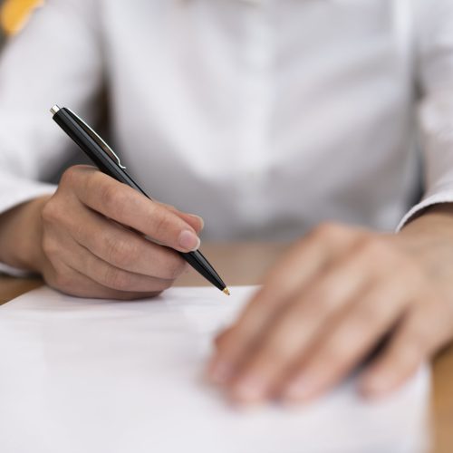 close-up-adult-ready-sign-papers