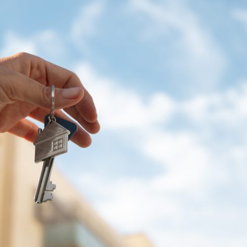 hand-holding-key-with-copy-space